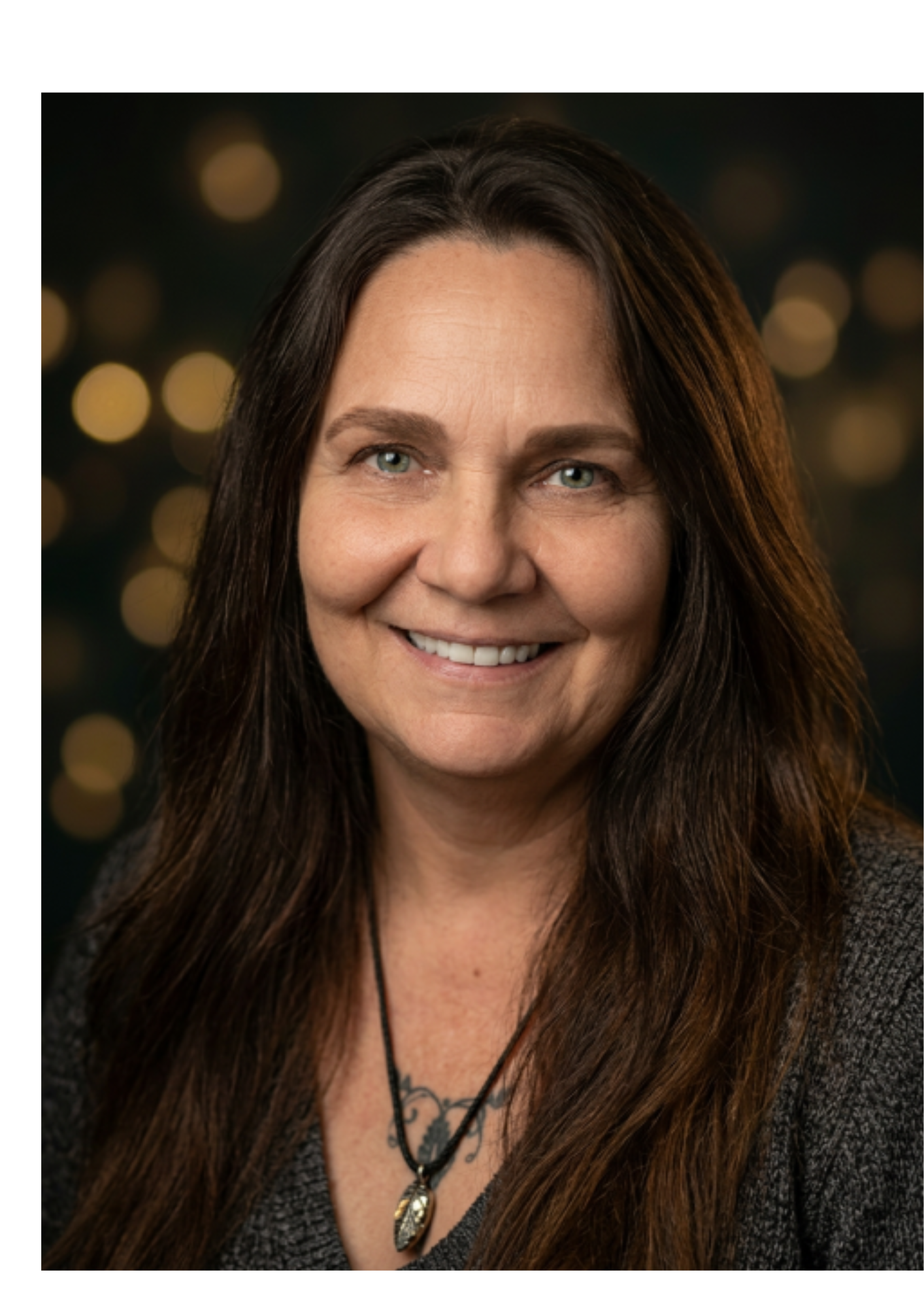 Jacqueline, founder of Move365Life, smiling portrait against warm gold lights